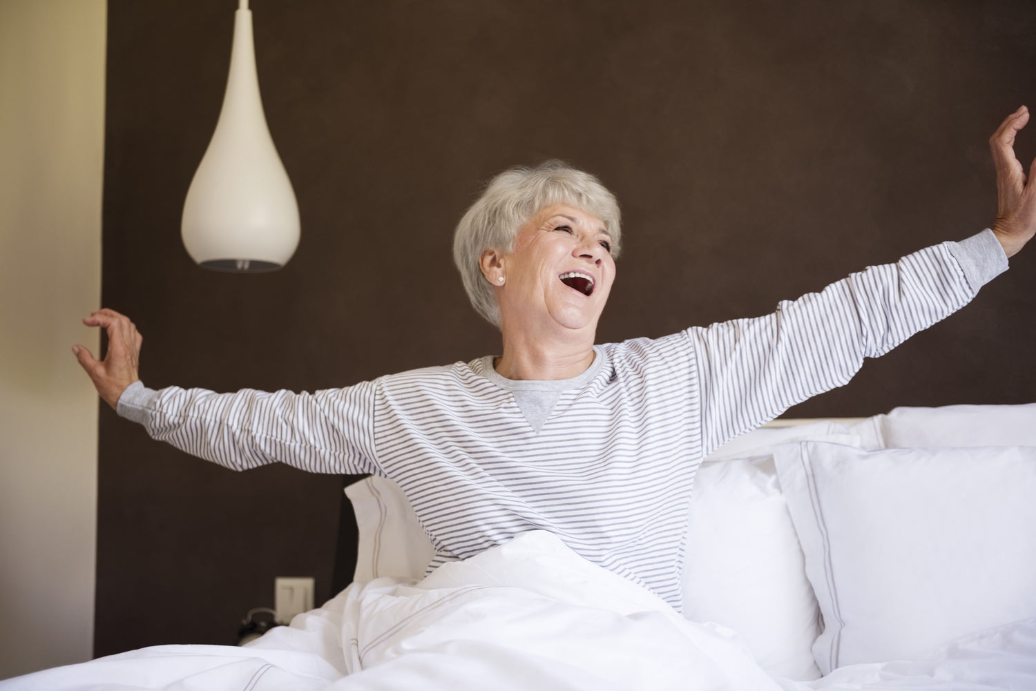 well rested older woman after using Abaca mattress